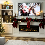 A modern fireplace decorated with Christmas stockings and ornaments.