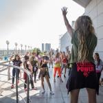 A group having a Zumba party at the top floor of a hotel.