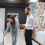 A young couple choosing new bathroom furniture.