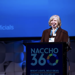 Lori Freeman, CEO of the National Association of County and City Health Officials, speaks at the organization's annual conference in July. 