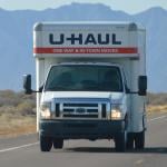 A U-Haul truck on a highway.