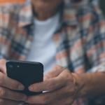 A man using a smartphone.