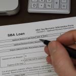 An SBA loan application form being filled out.