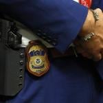  A detail view of the badge worn by deputy assistant director of field operations at ICE headquarters in Washington. U.S. Immigration and Customs Enforcement (ICE) major hiring event in Arlington, Texas.