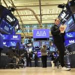 Traders work on the floor of the New York Stock Exchange during morning trading on November 19, 2025 in New York City.