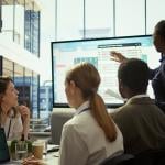 An accounting team reviewing budget and financial reports.