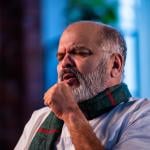 A senior man coughing.