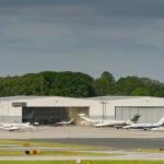 Private jets lined up outside at an airport terminal in Baltimore.
