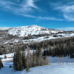 An aerial view of Brian Head ski resort in winter on a clear day.