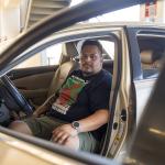 Edgar Rosales Jr. sits in the car where he lived for more than a year as a participant in the Safe Parking Program at Long Beach City College in Long Beach, Calif. There, he said, “you don’t have to be scared.”