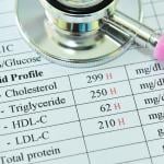 A stethoscope over a lipid test document with high results.