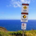 Warning signs along the Makapu'u Trail on Oahu island in Hawai'i.