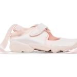 A side view of a Nike Air Rift ballerina shoe in light pink colorway.
