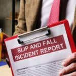A slip and fall incident report on a clipboard.