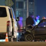 Cars crashed heavily in a road accident at night.