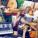 A pile of different musical instruments.