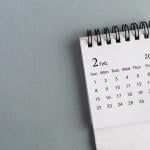 A small desk calendar showing February 2026.