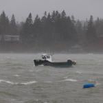 A lobster boat at sea during a storm in the North Haven Harbor, Maine.