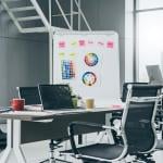 A modern office space with a creativity board.