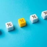 Interest rate represented by dice with percentage symbols.