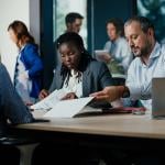 A small diverse business team project planning in a modern office.