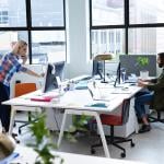 Two businesspeople working in a creative office.