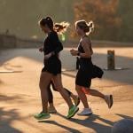 A group of women jogging outdoors.