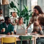 A diverse business team discussing a project in an office environment.