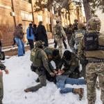 US Border Patrol / ICE agents detain a person near Roosevelt High School during dismissal time as federal immigration enforcement actions sparked protests in Minneapolis, Minnesota, on January 7, 2026. 