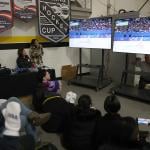 Community members watch local skater Alysa Liu compete in the Milano Cortina 2026 Winter Olympic games during a watch party at the Oakland Ice Center in Oakland, California on Thursday, Feb. 19, 2026