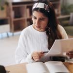A person going through paperwork at home. 