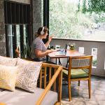 A freelancer working remotely from a home balcony. 