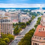 An aerial shot of Pennsylvania Avenue and a view of U.S. Capitol. 