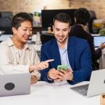 A diverse business team working together on a project in an office.