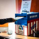 A voter casting an absentee ballot at the Sterling Heights Election Center in Michigan, USA.