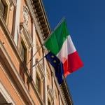 Italy and European Union flags on a balcony of a building in Reggio Emilia City, Italy. 
