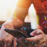 Person analyzing cryptocurrency data on a phone.