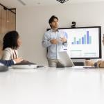 A speaker giving a presentation to a business team.