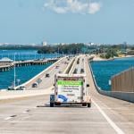 A U-Haul trailer truck crossing the Tampa Bay bridge in Florida.