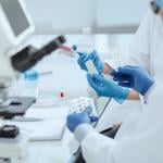 Pharmacists reviewing a new drug in a laboratory.