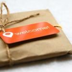 A brown package with an orange welcome tag.