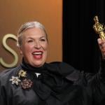 Kate Hawley holding up her Oscar trophy during the 98th Annual Academy Awards.