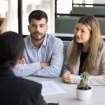 A couple seeking advice from a financial advisor.