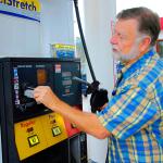 A man pays for gas at a station with credit card.