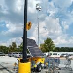 A solar powered surveillance system in a shop's parking lot in Atlanta, Georgia.