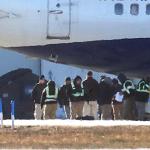 A charter flight picks up federal migrant detainees at Hanscom Field for a flight to Louisiana on December 12, 2025. 
