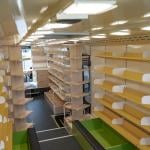 Interior of a modern bus converted into a small library.