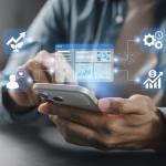 Person using smartphone illustration with CRM system graphics.