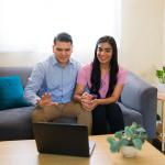 A couple at home attending a virtual therapy session.