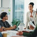 A businesswoman leading a marketing team's meeting.